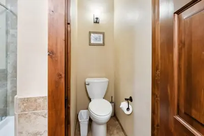 a bathroom with a toilet and a shower at Spacious Ski Townhome with Game Room Fun in Breckenridge