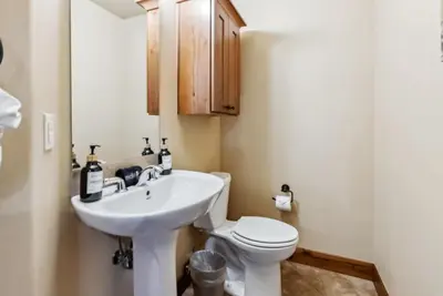 a bathroom with a sink and a toilet at Spacious Ski Townhome with Game Room Fun in Breckenridge