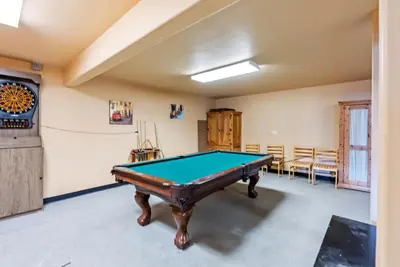 a room with a pool table in it at Spacious Ski Townhome with Game Room Fun in Breckenridge