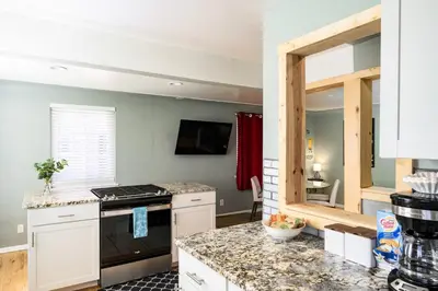 a kitchen with a stove and a counter top at Movie Theater + Hot Tub | Game Yard | Sleeps 10! in Arvada