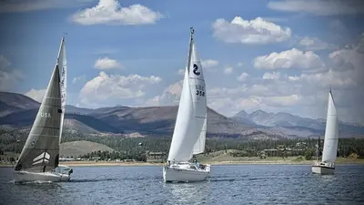 three sailboats in the water on a lake at Aspen Meadows C-303, 0017 in Granby