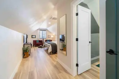 a hallway with a door leading to a bedroom at Morrison Getaway - 2BR House BBQ Free Parking in Morrison
