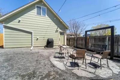 a group of chairs and a table in front of a house at Morrison Getaway - 2BR House BBQ Free Parking in Morrison