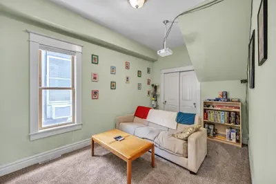 a living room with a couch and a table at Stylish 2-Story Home - Perfect Denver Location home in Denver
