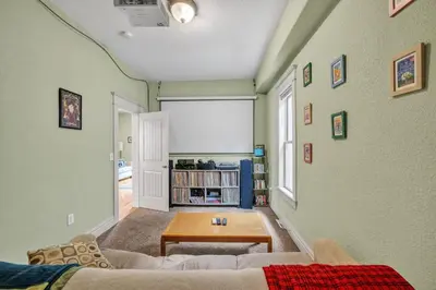 a living room with a couch and a table at Stylish 2-Story Home - Perfect Denver Location home in Denver