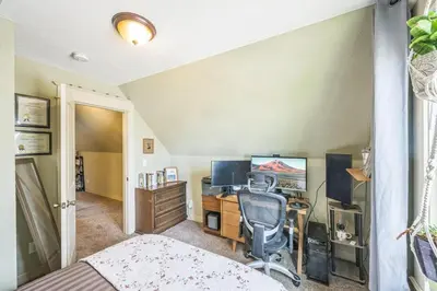 a bedroom with a desk with a computer and a chair at Stylish 2-Story Home - Perfect Denver Location home in Denver