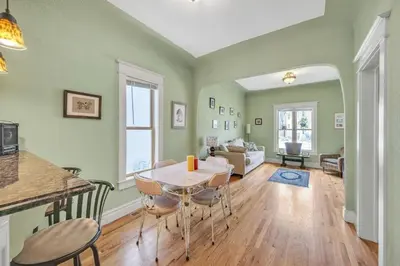 a kitchen and living room with a table and chairs at Stylish 2-Story Home - Perfect Denver Location home in Denver