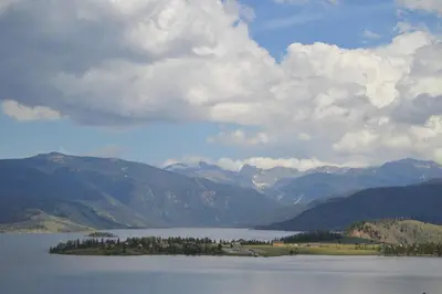a large body of water with mountains in the background at Bluejay bunkhouse in Grand Lake