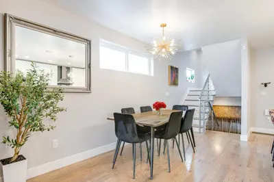 a dining room with a table and chairs at 1 Mi to Dtwn Denver Sleek Duplex with Rooftop Deck! in Denver