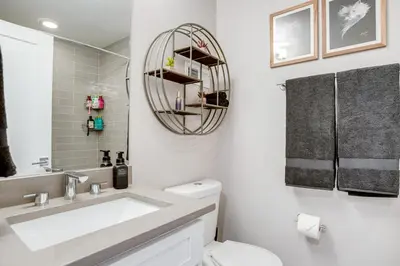 a bathroom with a sink and a toilet at 1 Mi to Dtwn Denver Sleek Duplex with Rooftop Deck! in Denver