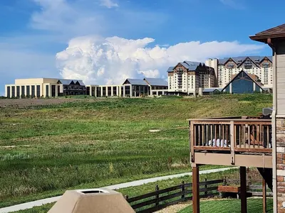 a view of a city from the balcony of a house at Entire Basement with private Entrance within walking distance from the Gaylord hotel in Aurora