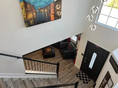an overhead view of a living room with a staircase at DIA Layover B&B in DEN