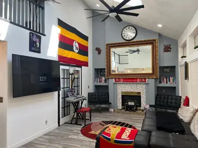 a living room with a tv and a fireplace at DIA Layover B&B in DEN
