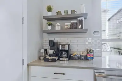 a kitchen counter with a coffee maker on it at 3br W King Bed, Sauna, Parking-6 Min To Olde Town in Arvada