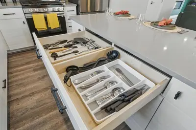 a kitchen with a drawer filled with tools at 3br W King Bed, Sauna, Parking-6 Min To Olde Town in Arvada
