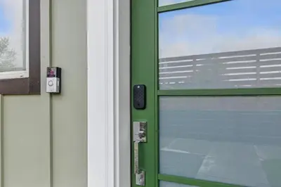 a green door with a window on it at 3br W King Bed, Sauna, Parking-6 Min To Olde Town in Arvada