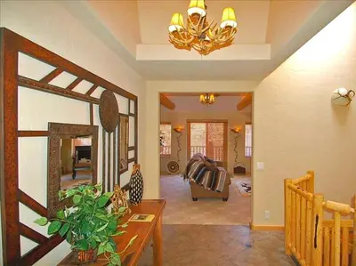 a living room with a mirror and a couch at Spacious Cabin with Breathtaking Views near Rocky Mountain National Park, Colorado in Estes Park
