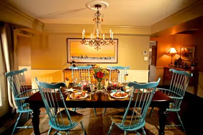 a dining room with a table with chairs and a chandelier at Western-Style Ranch Getaway for Two Guests near Fort Collins, Colorado in Livermore