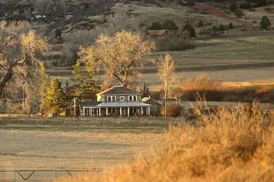 a house in the middle of a field at Gorgeous Ranch Stay Accommodation with Amazing Views in Livermore, Colorado in Livermore