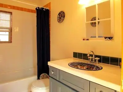 a bathroom with a sink and a toilet at Spacious Cabin Rental with a Hot Tub for a Weekend Getaway near Denver, Colorado in Idaho Springs