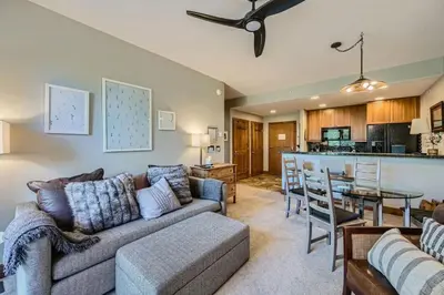 a living room with a couch and a table at Cozy 1BR Near Trails with Shuttle to Slopes and Town in Breckenridge