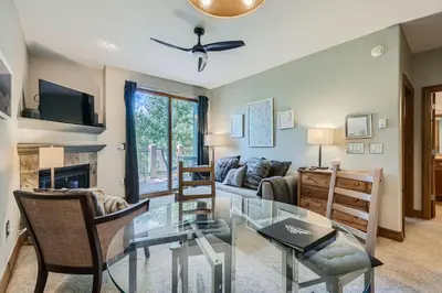 a living room with a couch and a table at Cozy 1BR Near Trails with Shuttle to Slopes and Town in Breckenridge