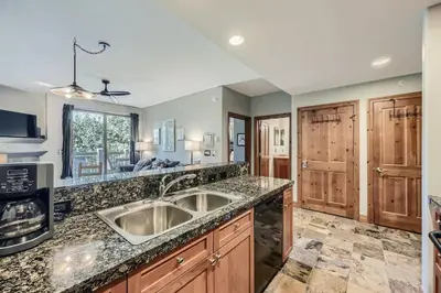 a kitchen with a sink and a counter top at Cozy 1BR Near Trails with Shuttle to Slopes and Town in Breckenridge