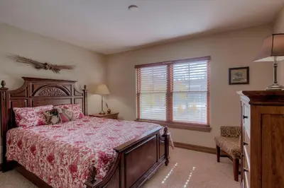 a bedroom with a large bed and a window at Beautiful Unit in Quiet Area with Shuttle to Slopes in Breckenridge