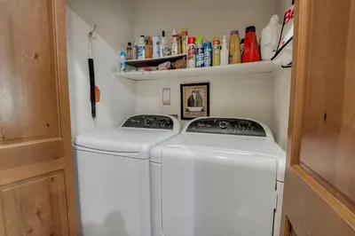 a laundry room with a washer and dryer at Beautiful Unit in Quiet Area with Shuttle to Slopes in Breckenridge