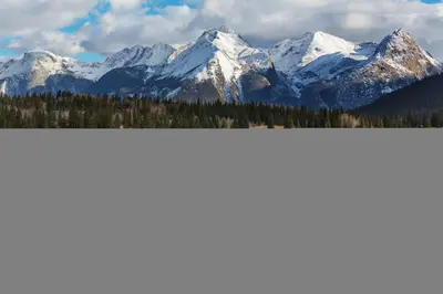 a mountain range with snow covered mountains at Beautiful Unit in Quiet Area with Shuttle to Slopes in Breckenridge