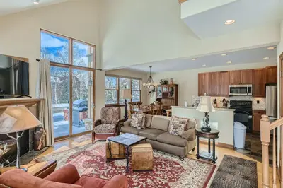 a living room with a couch and a table at Beautiful Unit in Quiet Area with Shuttle to Slopes in Breckenridge