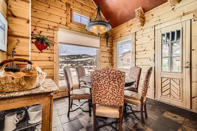 a dining room with a table and chairs at 3BDR with Loft for 8 Hot Tub Sauna & Mtn Views in Breckenridge