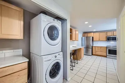 a kitchen with a washer and dryer in it at Charming 3 BDR for 8 in the Heart of the Rockies in Frisco