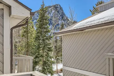 a house with a garage and a christmas tree at Charming 3 BDR for 8 in the Heart of the Rockies in Frisco