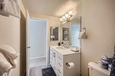 a bathroom with a sink and a mirror at Charming 3 BDR for 8 in the Heart of the Rockies in Frisco