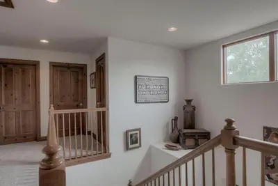 a staircase in a home with white walls at Spacious 4BR Near Trails with Shuttle to Slopes in Breckenridge