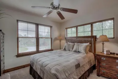 a bedroom with a bed and a ceiling fan at Spacious 4BR Near Trails with Shuttle to Slopes in Breckenridge