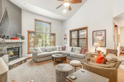 a living room with a couch and a fireplace at 3 BDR for 10 with Pool & Hot Tub Mins to Ski Lift in Dillon