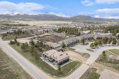 an aerial view of a town with a building at Townhouse w hot tub, gym & pool in Fraser