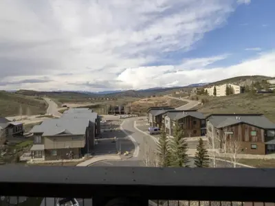 a view from a balcony of a town with houses at Base Camp One 410,0018 in Granby
