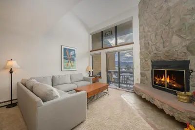a living room with a couch and a fireplace at Meadow Ridge Court 31 Unit 4 in Fraser