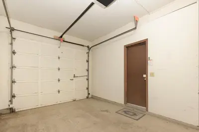 a garage with white walls and a door at Meadow Ridge Court 31 Unit 4 in Fraser