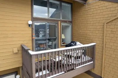 a balcony with a glass door on a house at Meadow Ridge Court 31 Unit 4 in Fraser