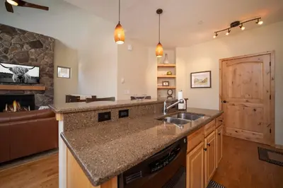 a kitchen with a sink and a counter top at Trailhead Lodges Building 701 Unit 731 in Winter Park