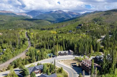 an aerial view of a village in the mountains at Townhome on Vasquez Creek #8 in Winter Park