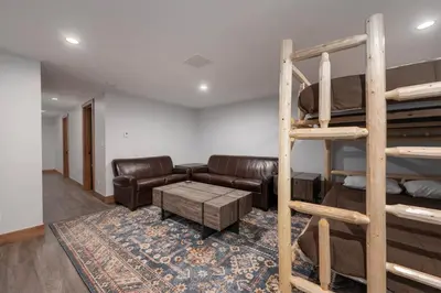 a living room with a couch and bunk beds at Townhome on Vasquez Creek #8 in Winter Park