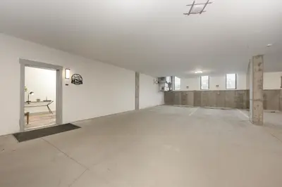 an empty room with a white wall and an open door at Timber Fox Building B Unit 2102 in Winter Park