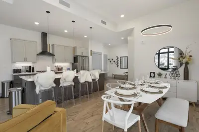 a kitchen and living room with a table and chairs at Timber Fox Building B Unit 2102 in Winter Park
