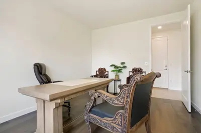 a dining room with a wooden table and chairs at Spacious Luxury Retreat Near Boulder & Denver in Superior