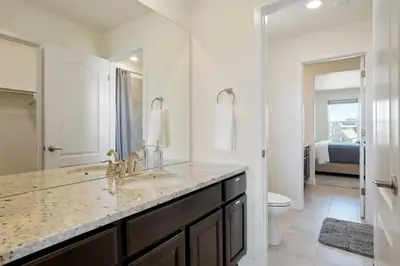 a white bathroom with a sink and a toilet at Spacious Luxury Retreat Near Boulder & Denver in Superior